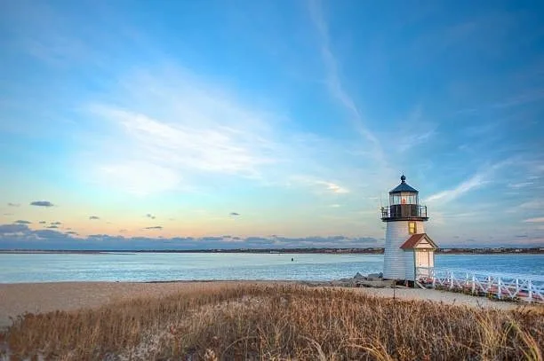 Brant Point Lighthouse on a Massachusetts shoreline at dusk